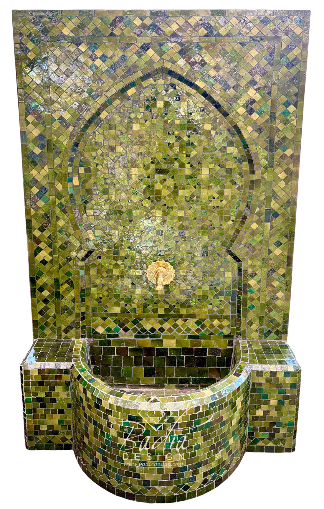 A Moorish-style mosaic tile fountain with a tall arched back panel and a curved basin, covered in green, olive, and gold-toned tiles with a small central spout.