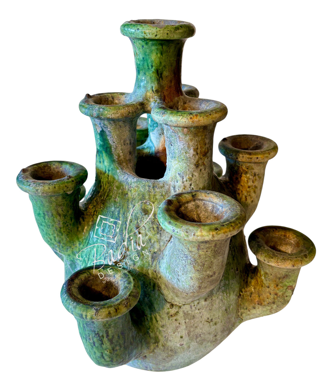 A rustic ceramic multi-socket holder, likely for candles or tea lights, featuring a textured green and brown glaze on a white background.