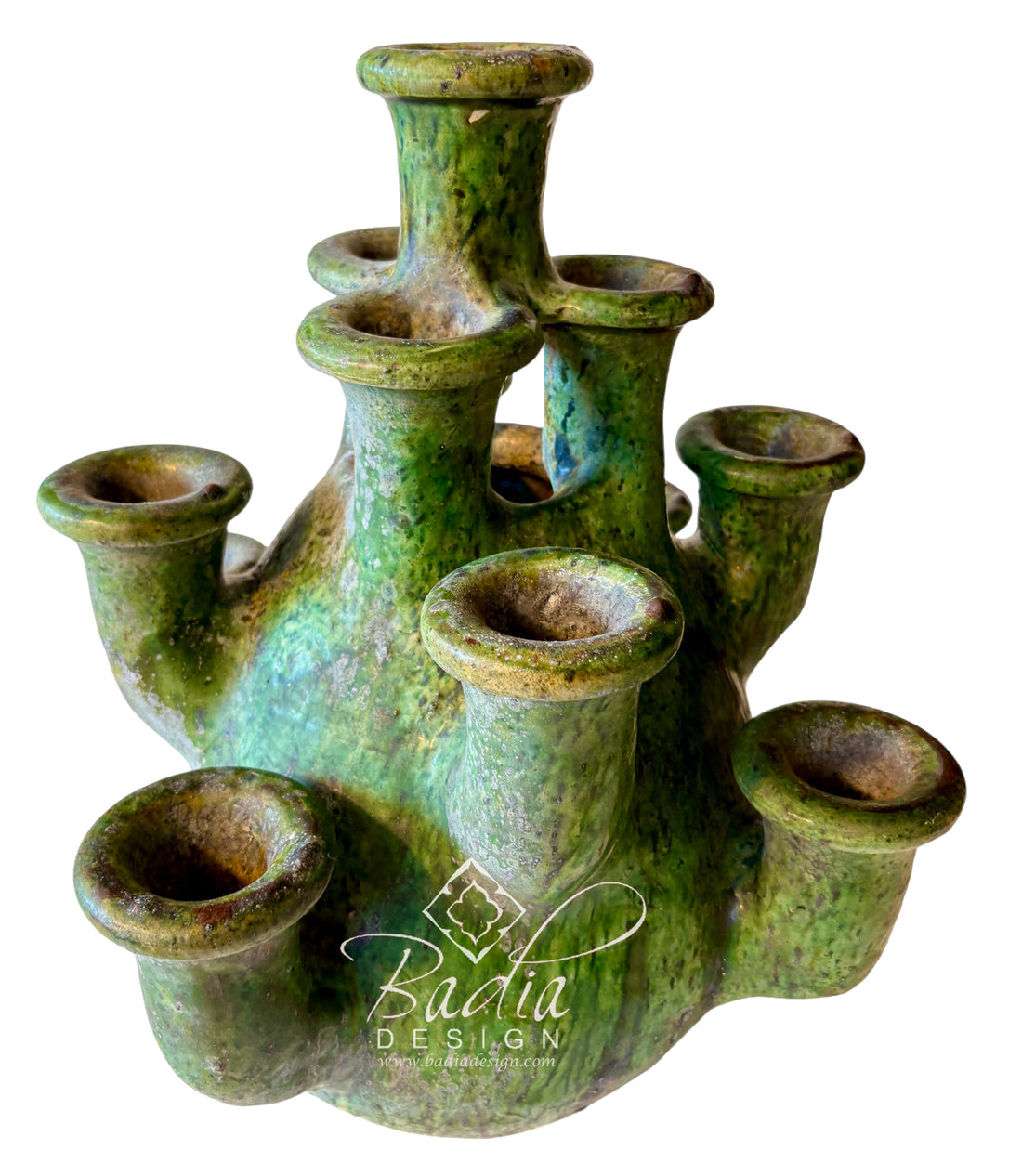 A green glazed ceramic multi-urn candle holder with multiple cylindrical candle sockets, shown on a white background with a &