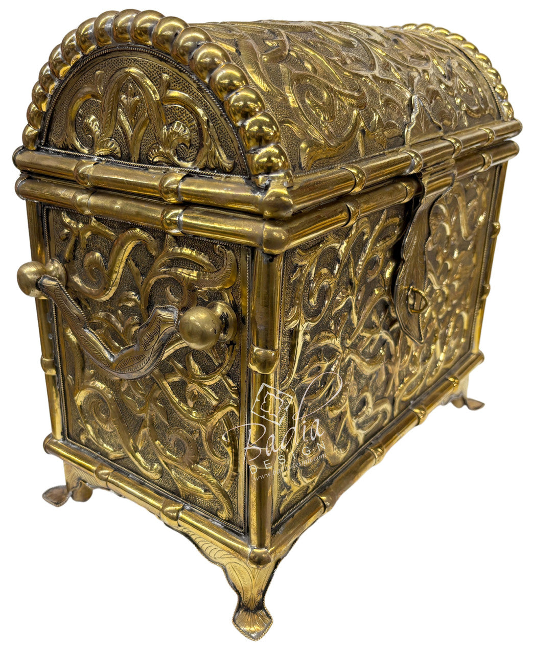 Decorative brass chest with intricate patterns on a white background