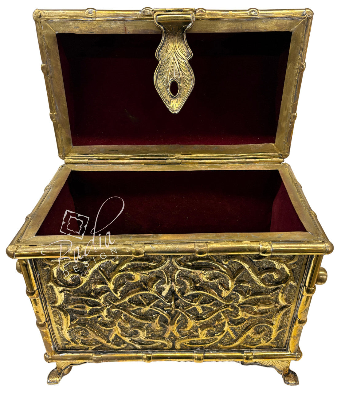 Decorative gold chest with intricate designs on a white background
