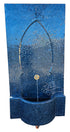 Blue mosaic wall fountain with intricate design and water feature.