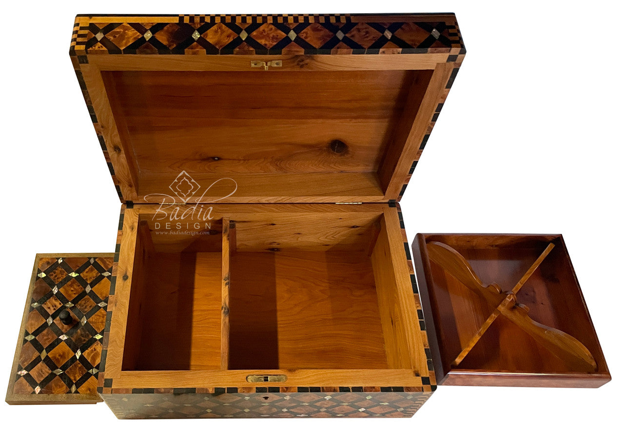 Wooden jewelry box with intricate inlay design on a white background