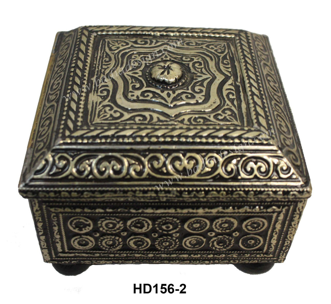 Decorative metal box with intricate patterns on a white background