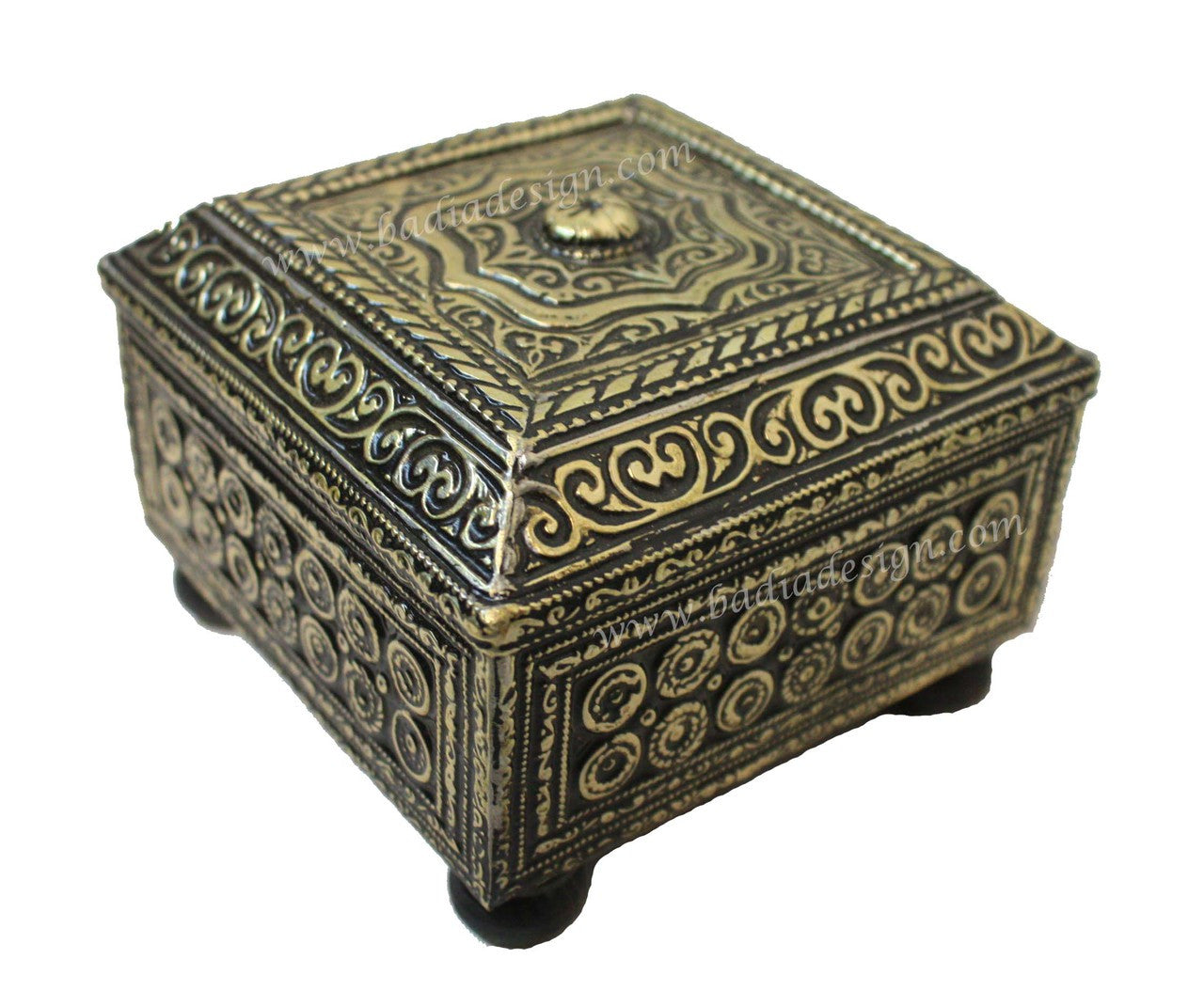 Decorative brass box with intricate patterns on a white background