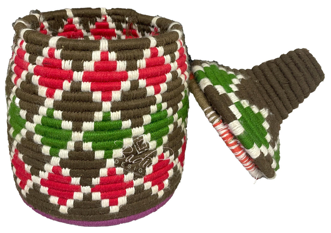 Woven basket with geometric pattern on a white background