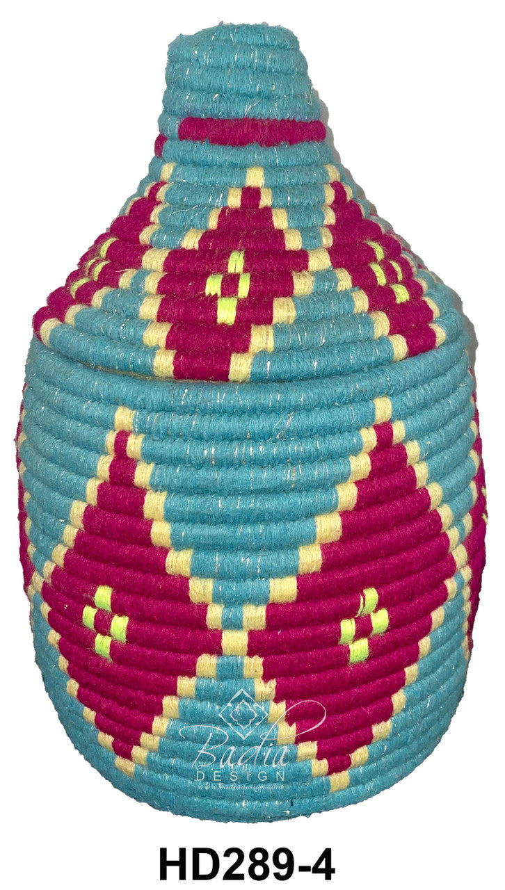 Colorful woven basket with geometric pattern on a white background