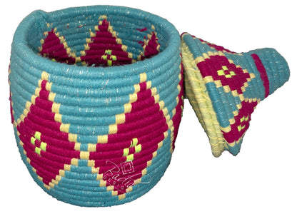 Woven basket with colorful geometric pattern on a white background