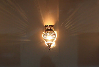 Moroccan Antique Brass Finish Wall Sconce with light background