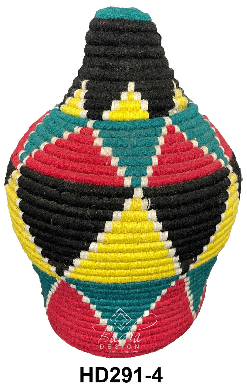 Colorful woven basket with geometric patterns on a white background