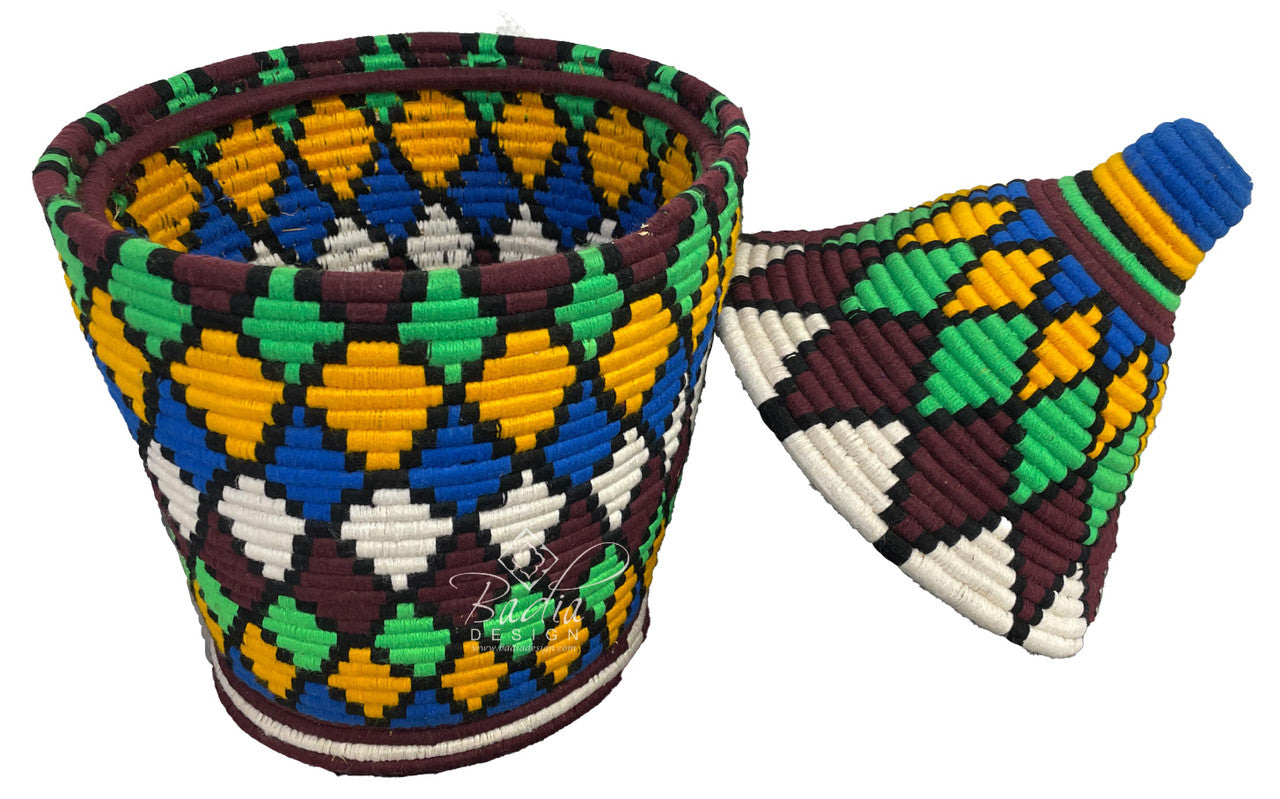 Colorful woven basket with geometric pattern on a white background