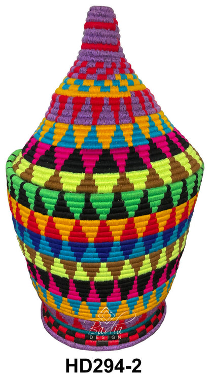 Colorful woven basket with geometric pattern on a white background