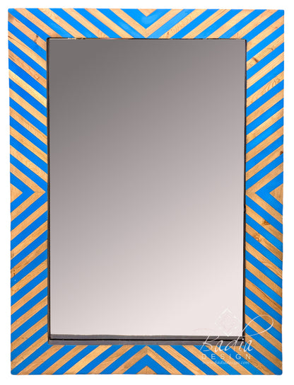 A rectangular wall mirror with a decorative frame featuring a blue and gold chevron pattern, shown against a plain white background.