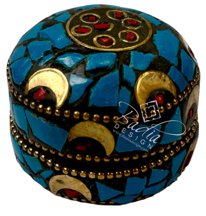 Decorative box with blue mosaic pattern and gold accents on a white background