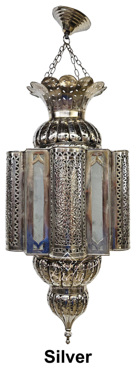 Decorative silver lantern with intricate designs on a white background