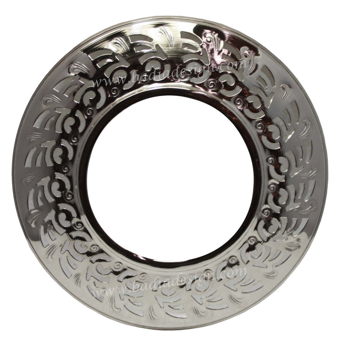 Decorative silver plate with intricate patterns on a white background