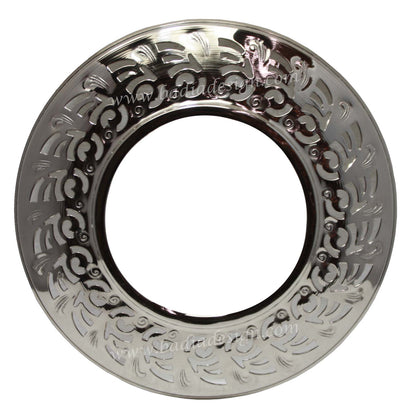 Decorative silver plate with intricate patterns on a white background
