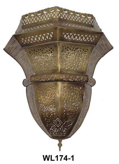 Decorative brass wall sconce with intricate patterns on a white background