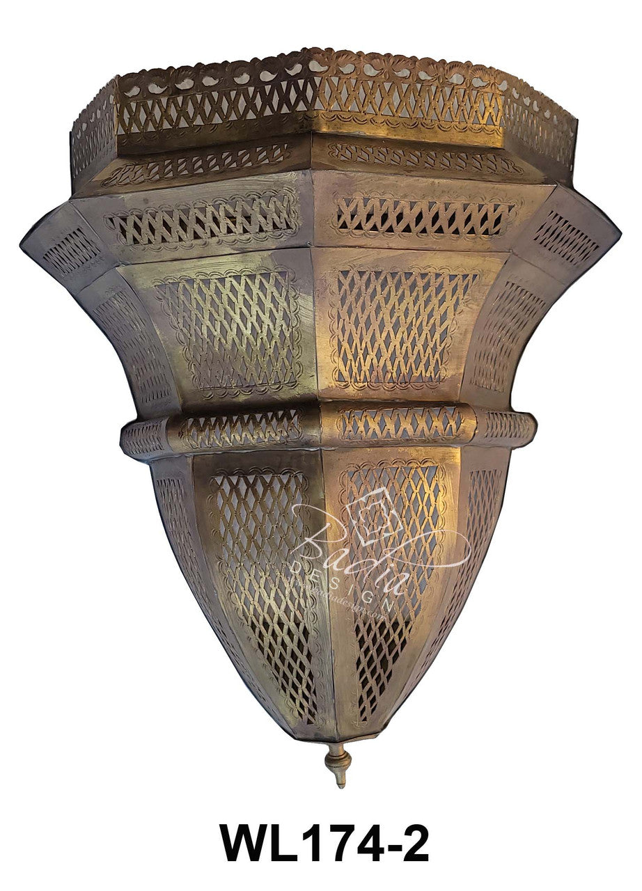 Decorative wall sconce with intricate design on a white background