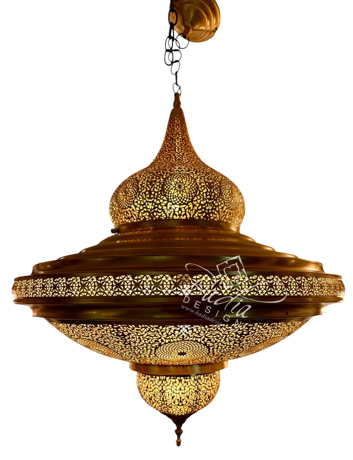 An ornate brass hanging chandelier with intricate cutout patterns, featuring a wide central band and three tiered dome-shaped sections, shown against a plain white background.