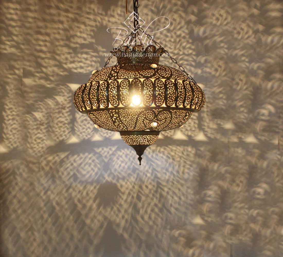 Decorative hanging lamp casting shadows on a textured wall