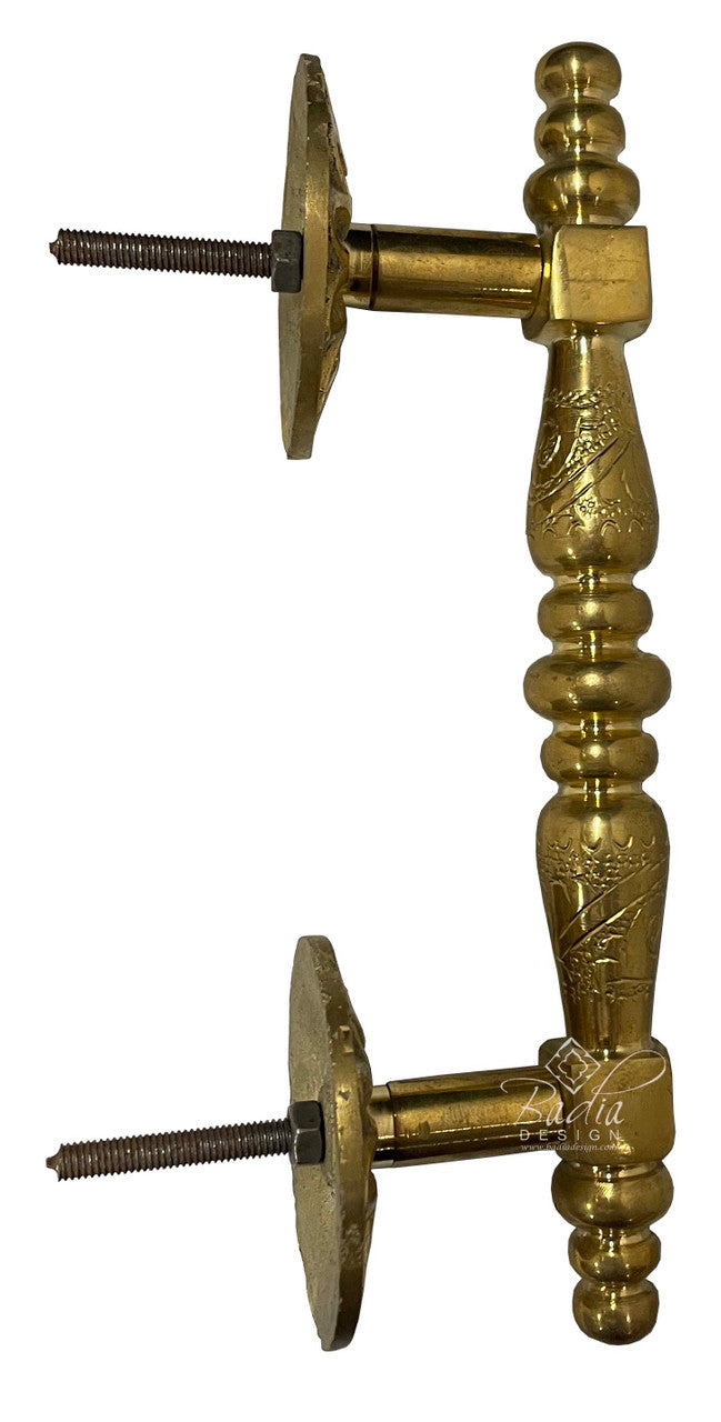 Brass door stopper with decorative design on a white background