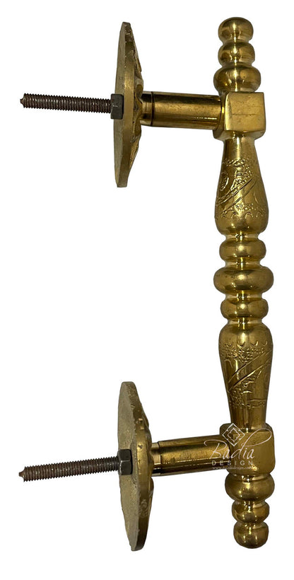 Brass door stopper with decorative design on a white background