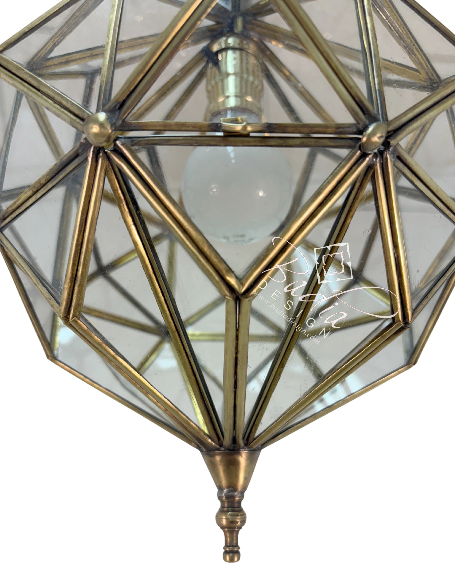 Geometric brass pendant light with clear glass cover on a white background