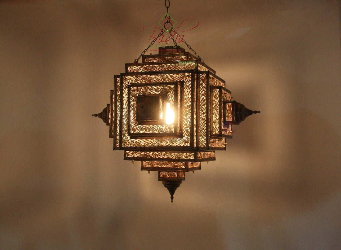 Decorative hanging lamp with intricate design on a plain background