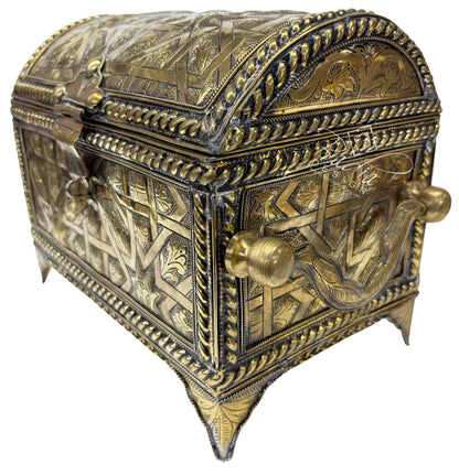 Decorative brass box with intricate designs on a white background