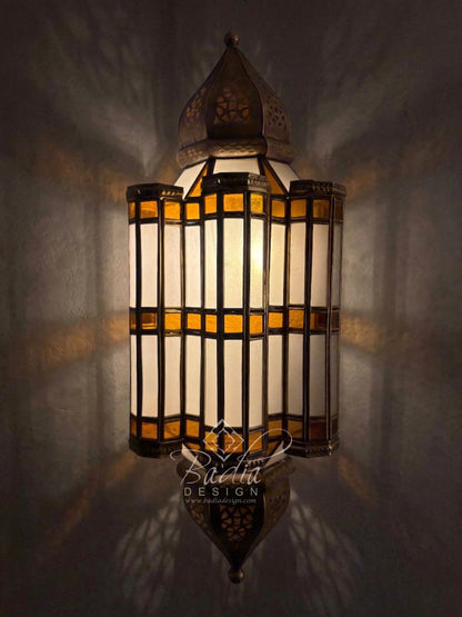 Decorative wall lamp with stained glass design on a dark background