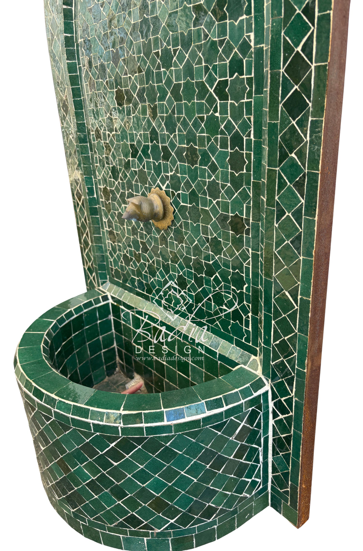 Green mosaic tiled corner shower with a drain.