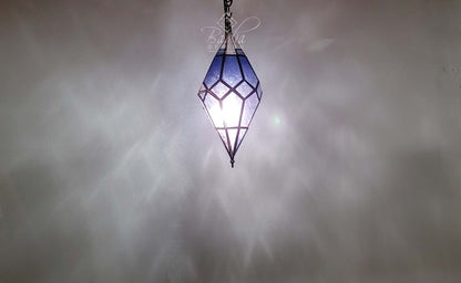 Decorative hanging lamp with geometric design on a gray background