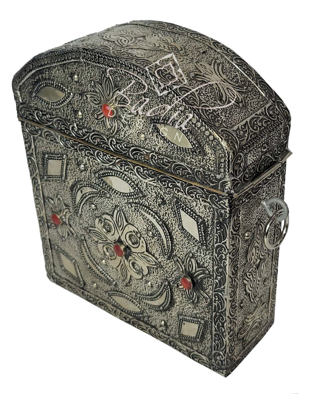 Decorative jewelry box with intricate patterns and red stones on a white background