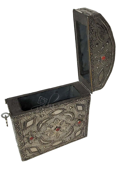Decorative jewelry box with intricate patterns on a white background