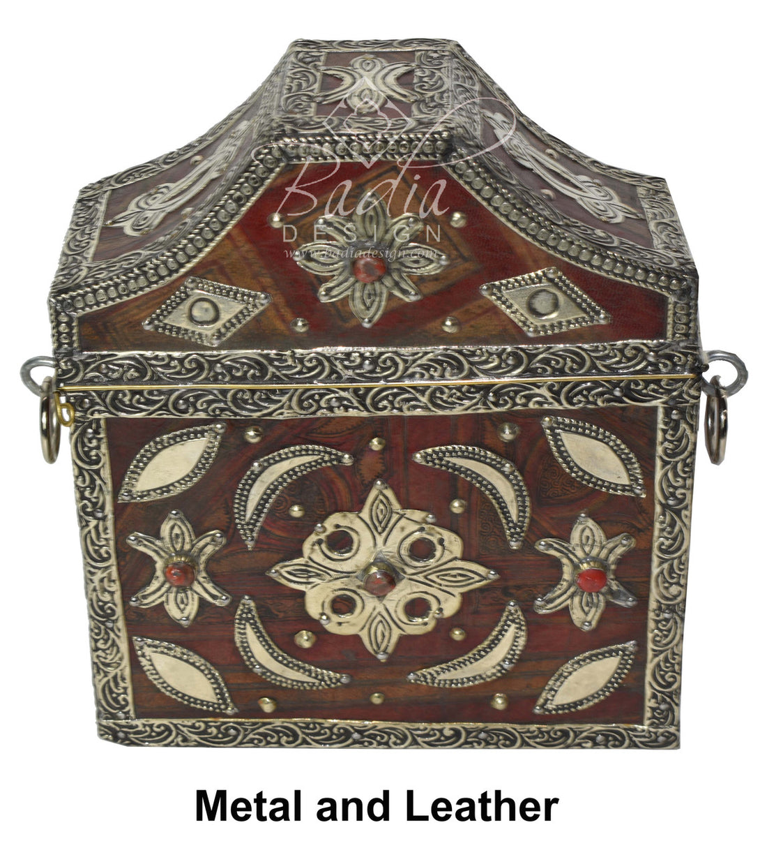 Decorative metal and leather box with intricate designs on a white background