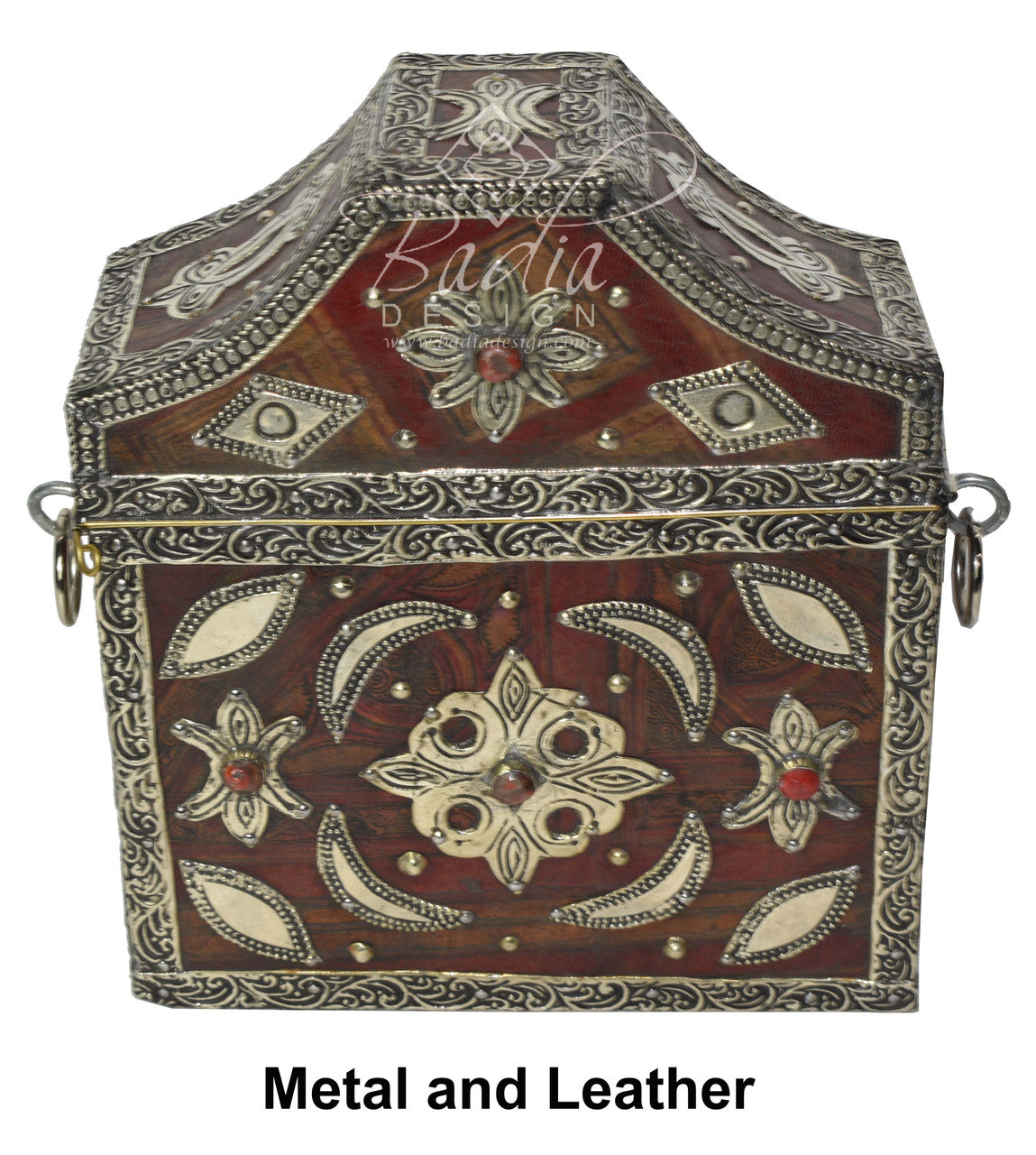 Decorative metal and leather box with intricate designs on a white background