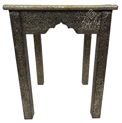Decorative console table with intricate carvings on a white background, featuring the Badiia Design logo.