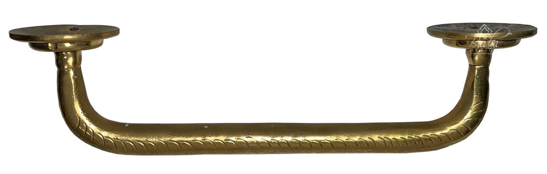 Decorative brass handle on a white background