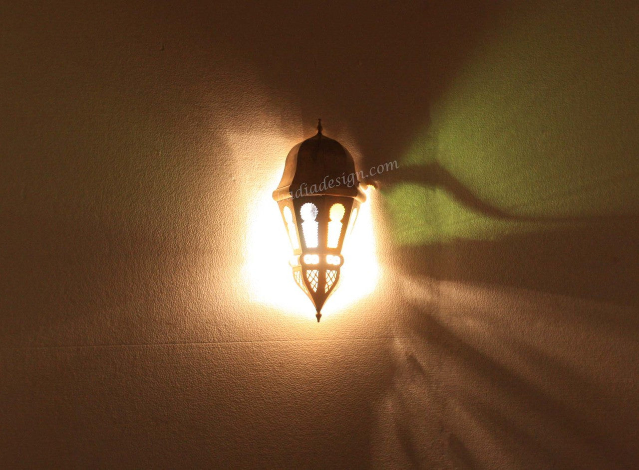 Decorative wall light fixture casting a shadow on a wall