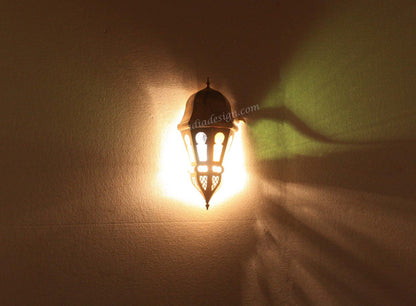 Decorative wall light fixture casting a shadow on a wall