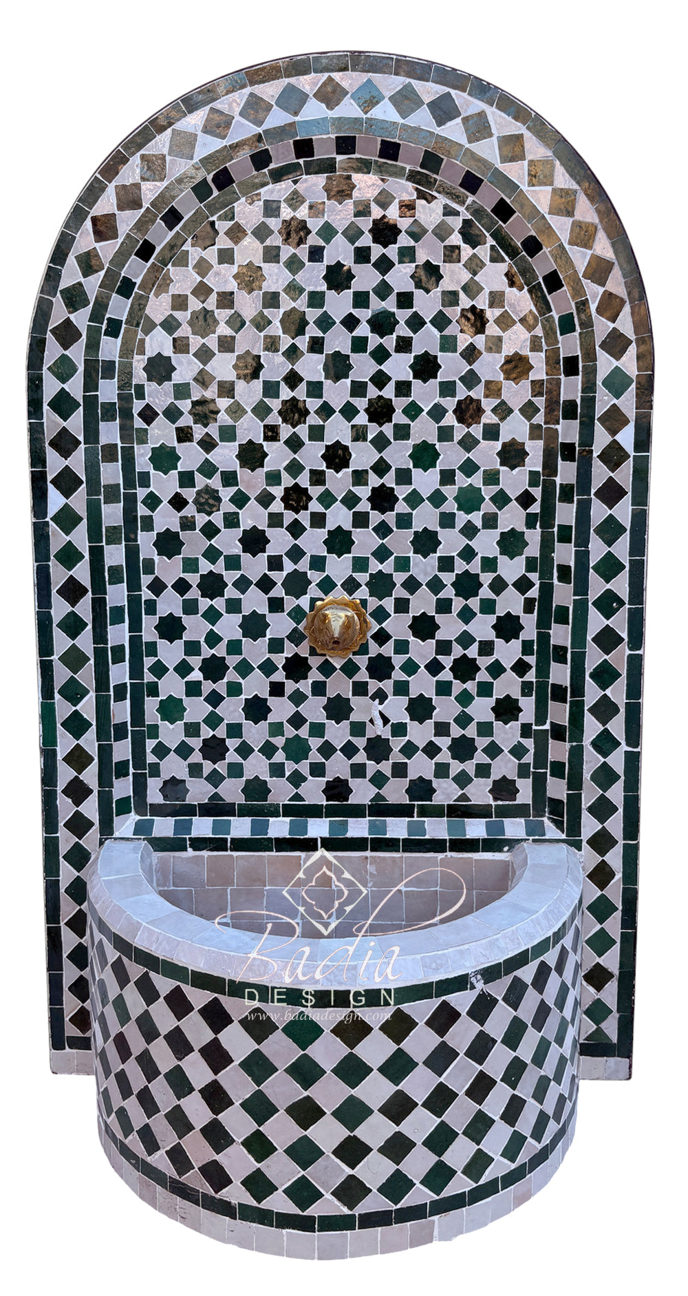 A Moroccan-style mosaic wall fountain with an arched back panel and a curved basin, decorated in green, white, black, and gray tile patterns with a central brass spout.