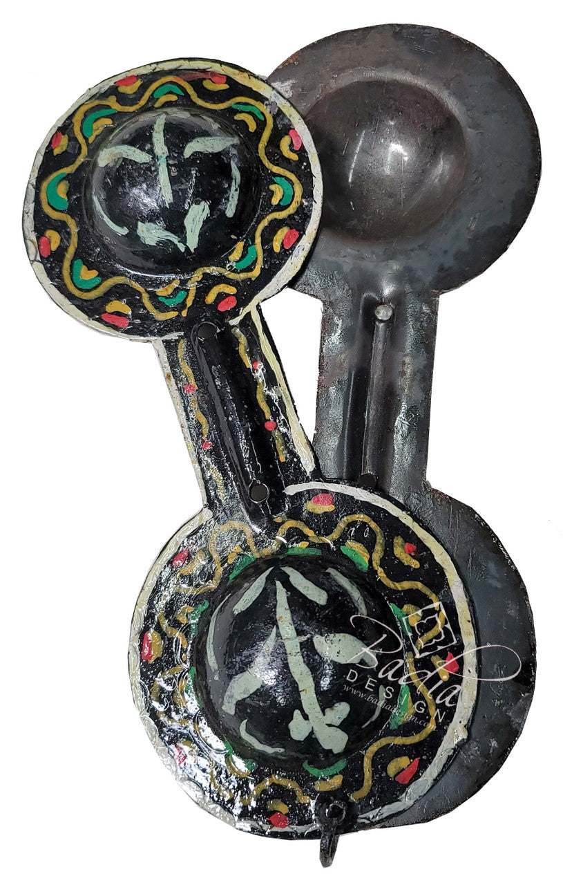 Decorative spoon with artistic designs on a white background