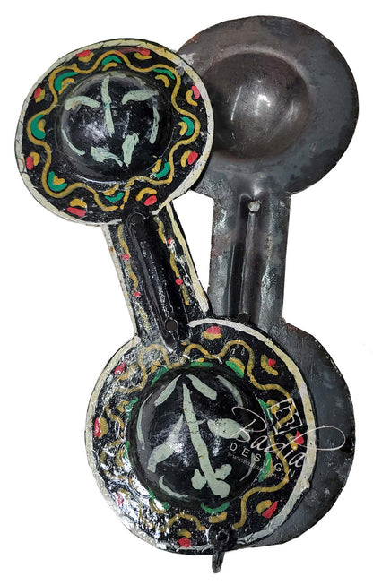 Decorative spoon with artistic designs on a white background
