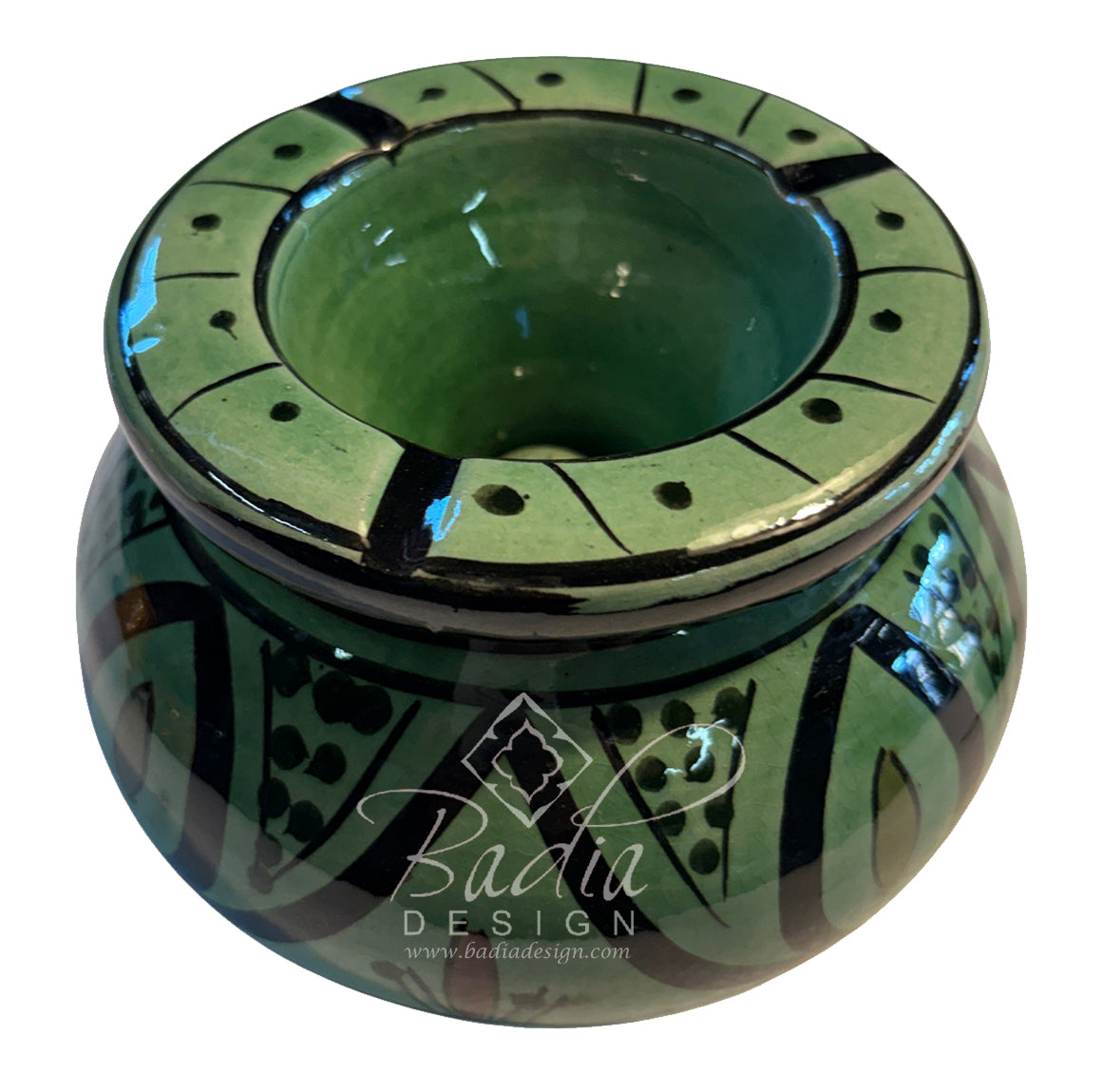 A green glazed ceramic pot with black hand-painted geometric patterns and a wide rim with small circular cutouts, shown on a white background with a &