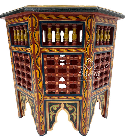Red Decorative wooden side table with intricate carvings and colorful patterns, featuring the brand &