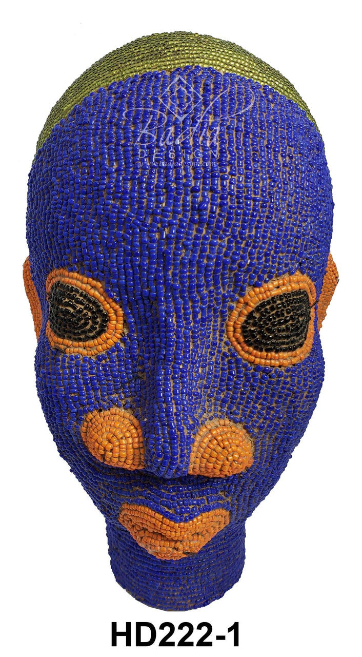 Blue and orange beaded mask with green top on a white background