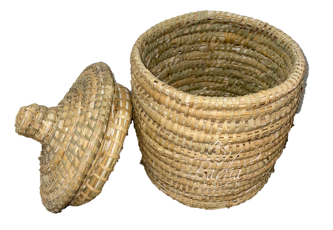 Woven basket with a lid on a white background
