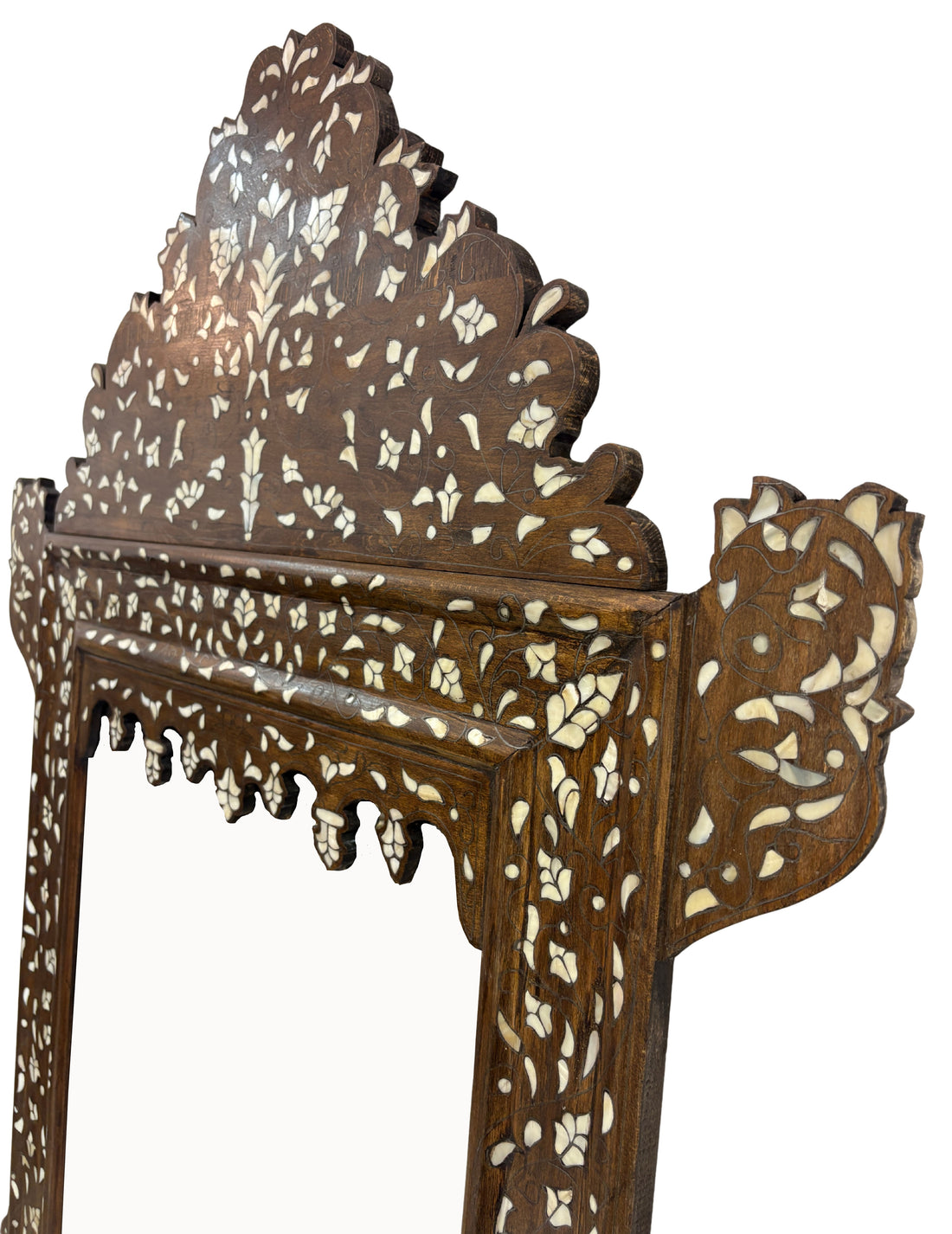 Decorative wooden frame with intricate white inlay patterns on a white background