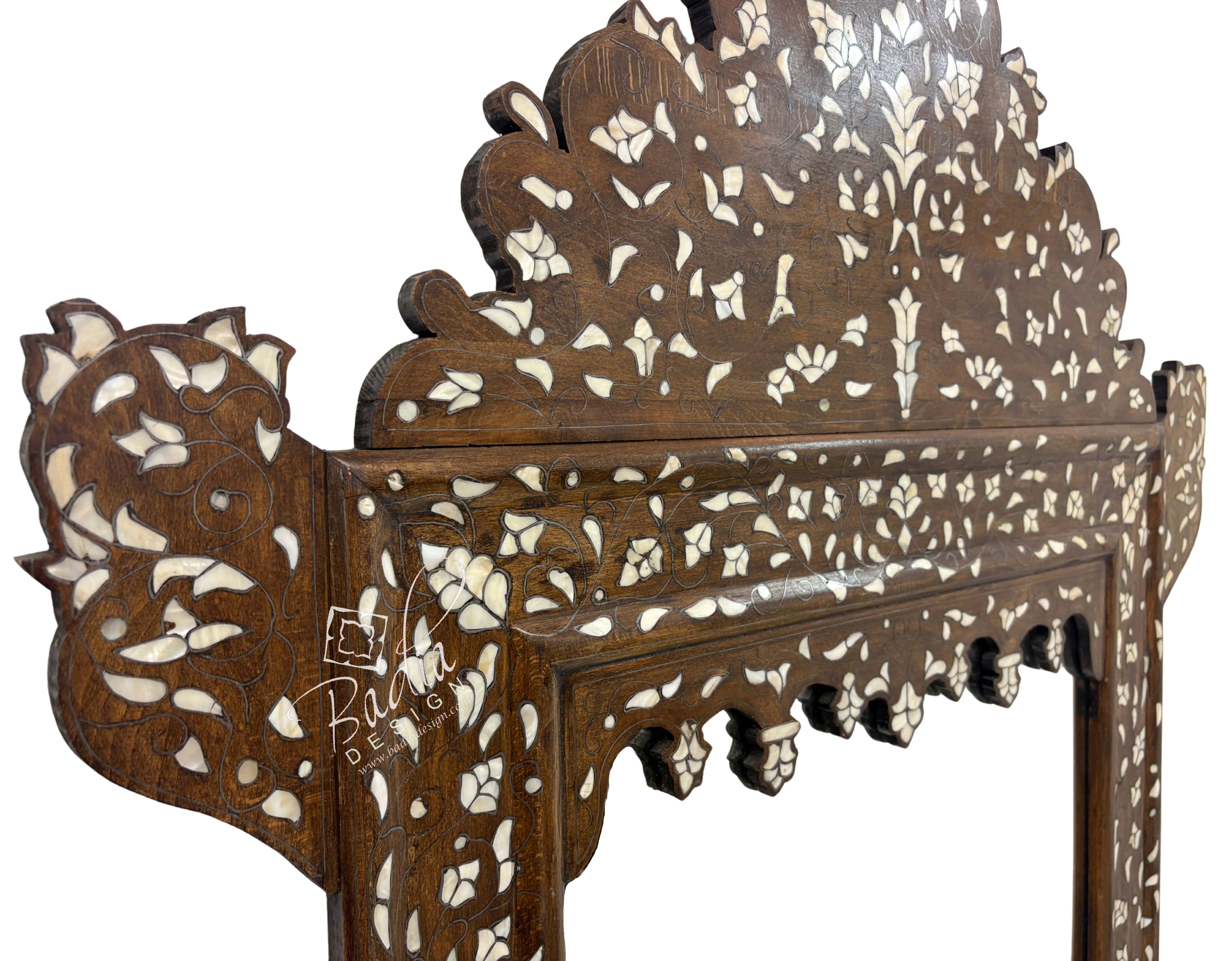 Decorative wooden panel with intricate carvings on a white background